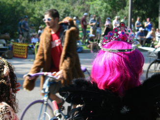 Tiaras, glitter, pink hair and feathers are common among bike riders in the Tour de Fat.