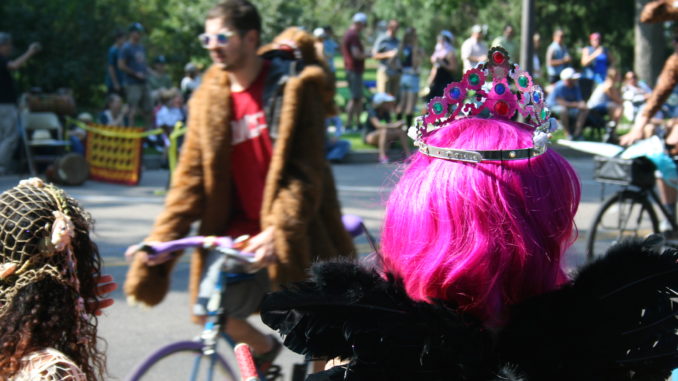 Tiaras, glitter, pink hair and feathers are common among bike riders in the Tour de Fat.