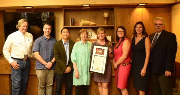 A Downtown Fort Collins Business Association delegation delivers the Wyoming Appreciation Weekend proclamation to Mayor Marian Orr at Cheyenne City Hall in October, 2018. Pictured from left to right: Pete Laybourn, Cheyenne City Council Ward I; Cameron Lalor, Downtown Business Association; James Yearling, Downtown Business Association; Susan Kirkpatrick, owner of Savory Spice Shop and former Fort Collins Mayor; Cheyenne Mayor, Marian Orr; Hannah Baltz-Smith, Downtown Business Association; Vanessa Kroeger, Downtown Business Association; Clark Harris, Laramie County Community College Vice President of Academic Affairs. 