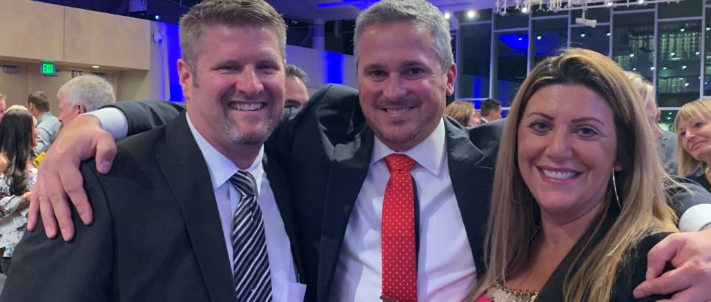 Pictured from left to right: Jason Kingery (an affiliated agent with Coldwell Banker), Ben Woodrum (honoree) and Natalie Antonelli (branch manager of the Coldwell Banker Fort Collins office).