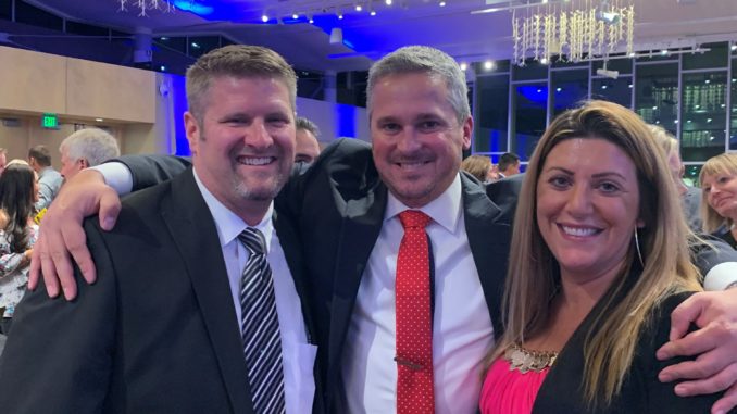 Pictured from left to right: Jason Kingery (an affiliated agent with Coldwell Banker), Ben Woodrum (honoree) and Natalie Antonelli (branch manager of the Coldwell Banker Fort Collins office).