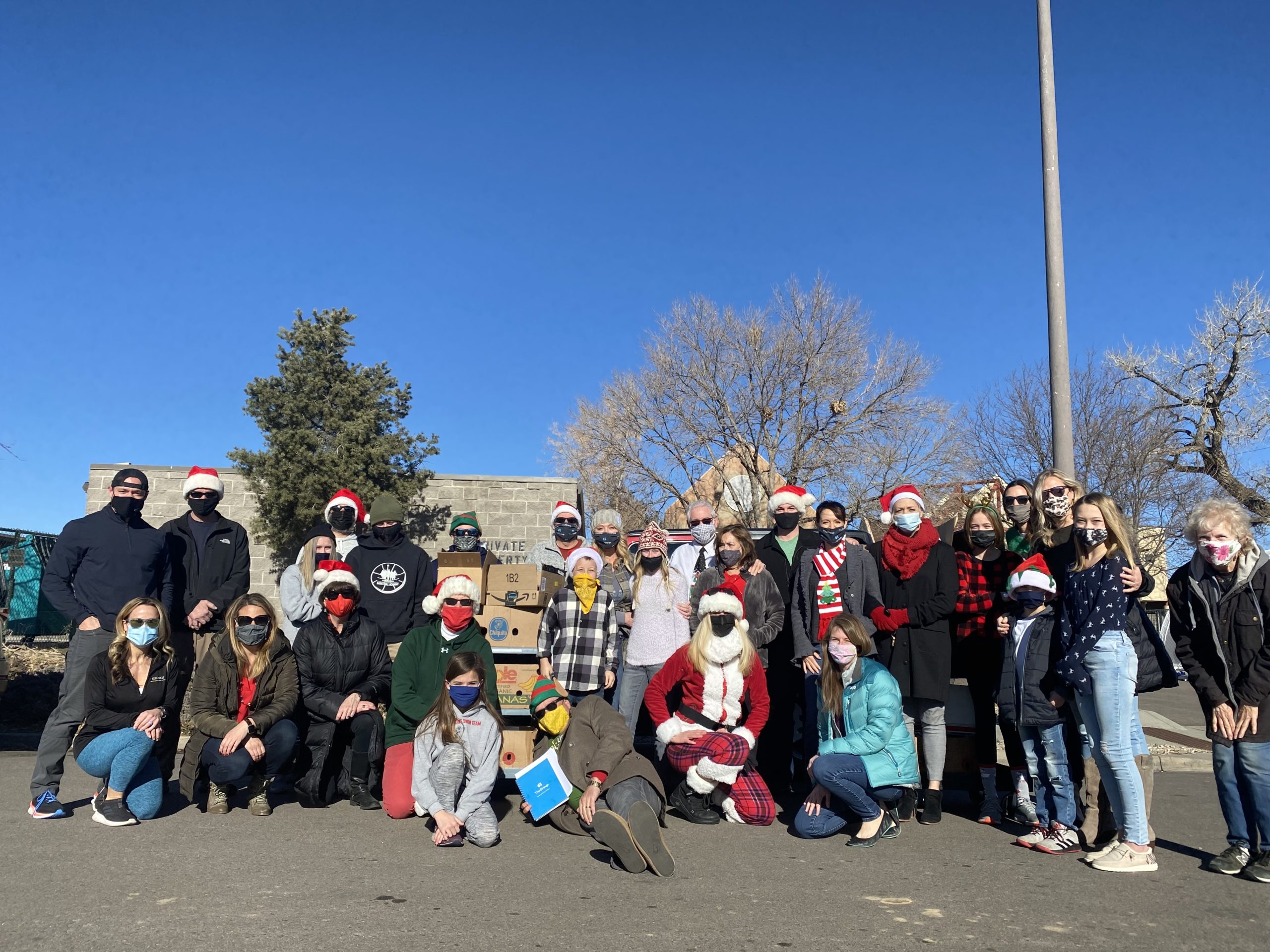 The Group Real Estate Delivers Holiday Meals to Seniors for Catholic Charities of Larimer County