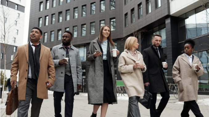 Coworkers Taking a Coffee Break and Walking