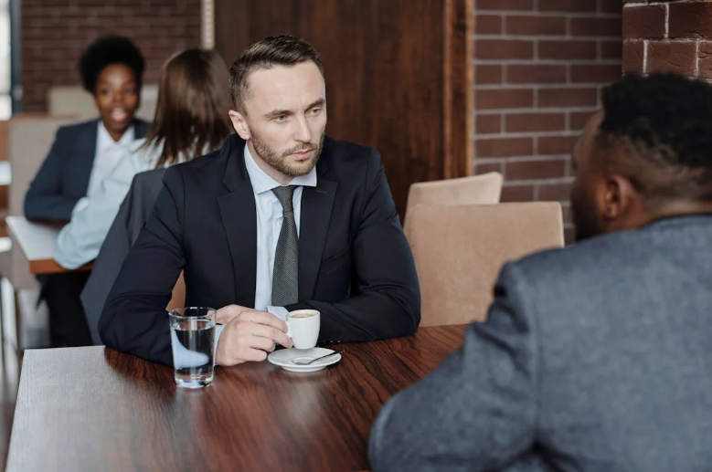 Businessmen Having a Meeting at a Cafe