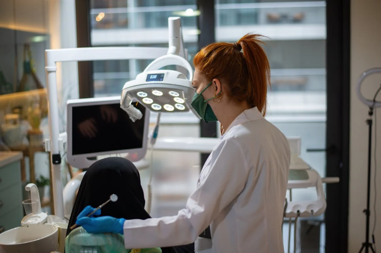 Alt-text: A Dentist Performing a Medical Procedure on a Patient